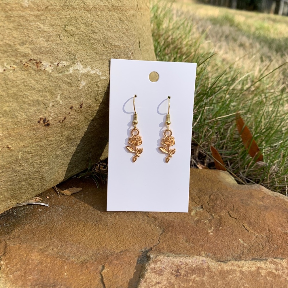 Gold colored rose earrings